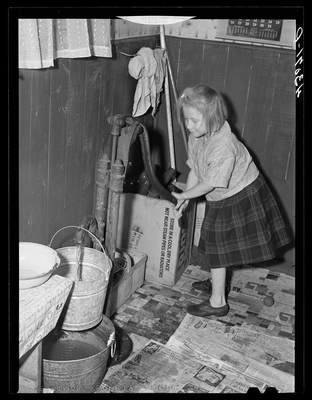 [Untitled photo, possibly related to: Daughter of a worker at the Pittsburgh Crucible Steel Corporation of Midland…