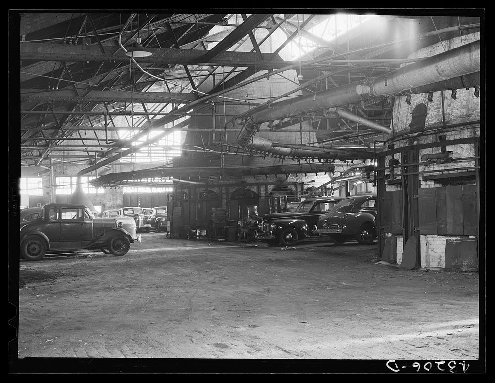 A closed glass works in Rochester, Pennsylvania, now used for car storage. Sourced from the Library of Congress.