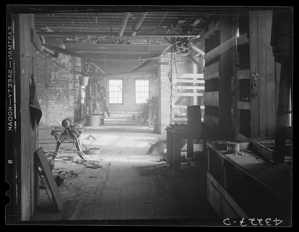 Interior of shut-down Olive Stove Works, Rochester, Pennsylvania. The company is now in the hands of receivers. Sourced from…