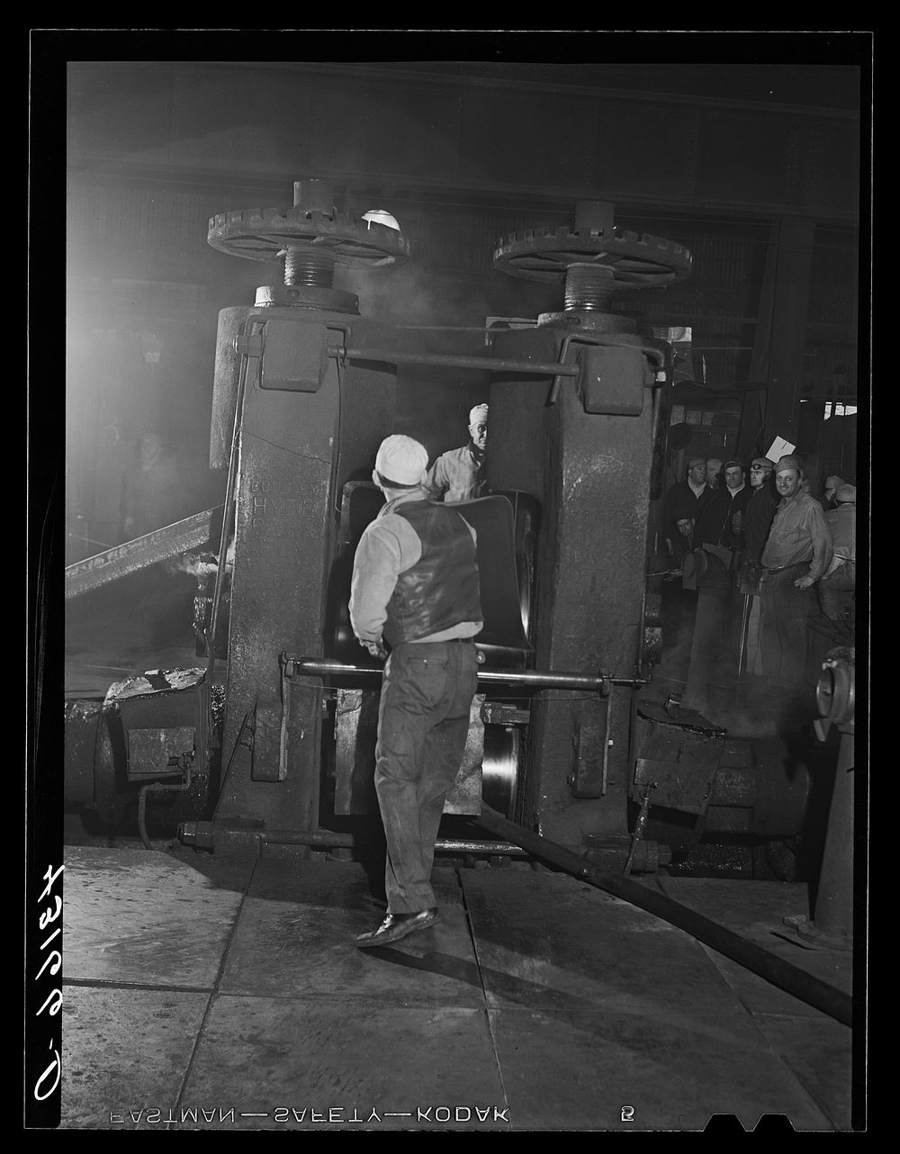 Workers at rolling machine in Washington Tinplate Company. Washington, Pennsylvania. Sourced from the Library of Congress.