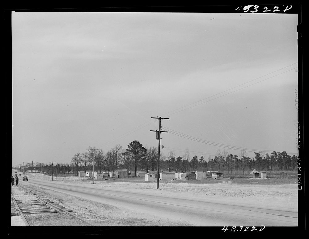 View of a settlement of shacks and trailers occupied by workers from Fort Bragg. Along Fayetteville--Fort Bragg road. North…
