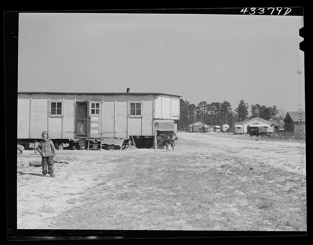 A large homemade trailer in a settlement of workers from Fort Bragg, near Manchester, North Carolina. Sourced from the…