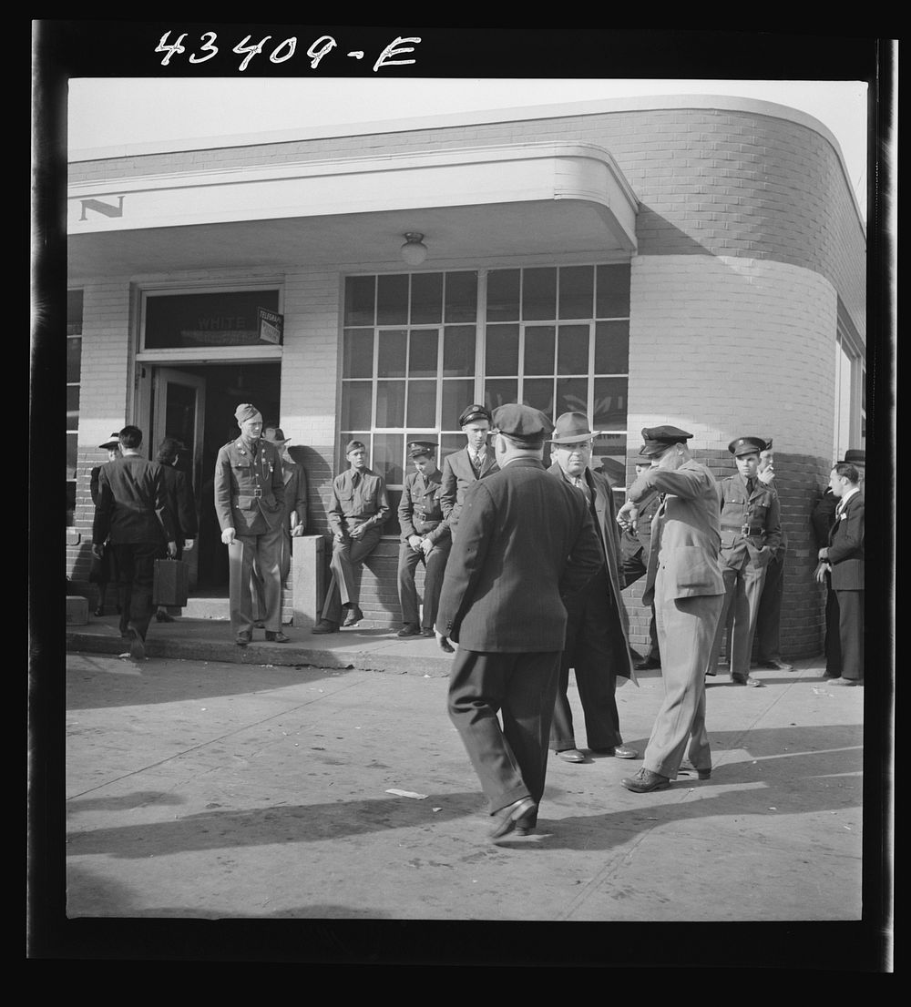 [Untitled photo, possibly related to: Crowds outside the bus station in Fayetteville, North Carolina]. Sourced from the…