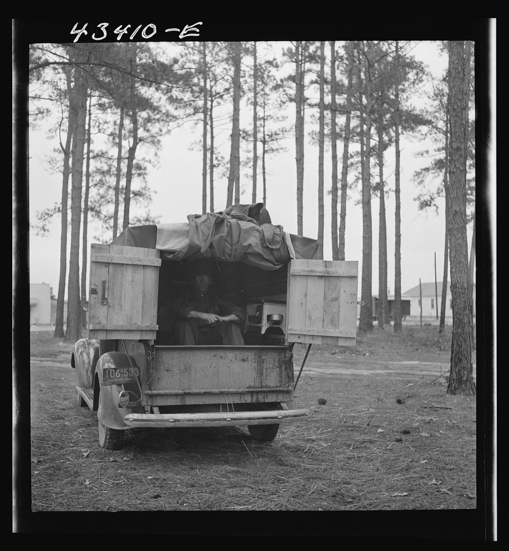 [Untitled photo, possibly related to: The rear end of this man's truck is his home. It includes a bed, small stove, and his…