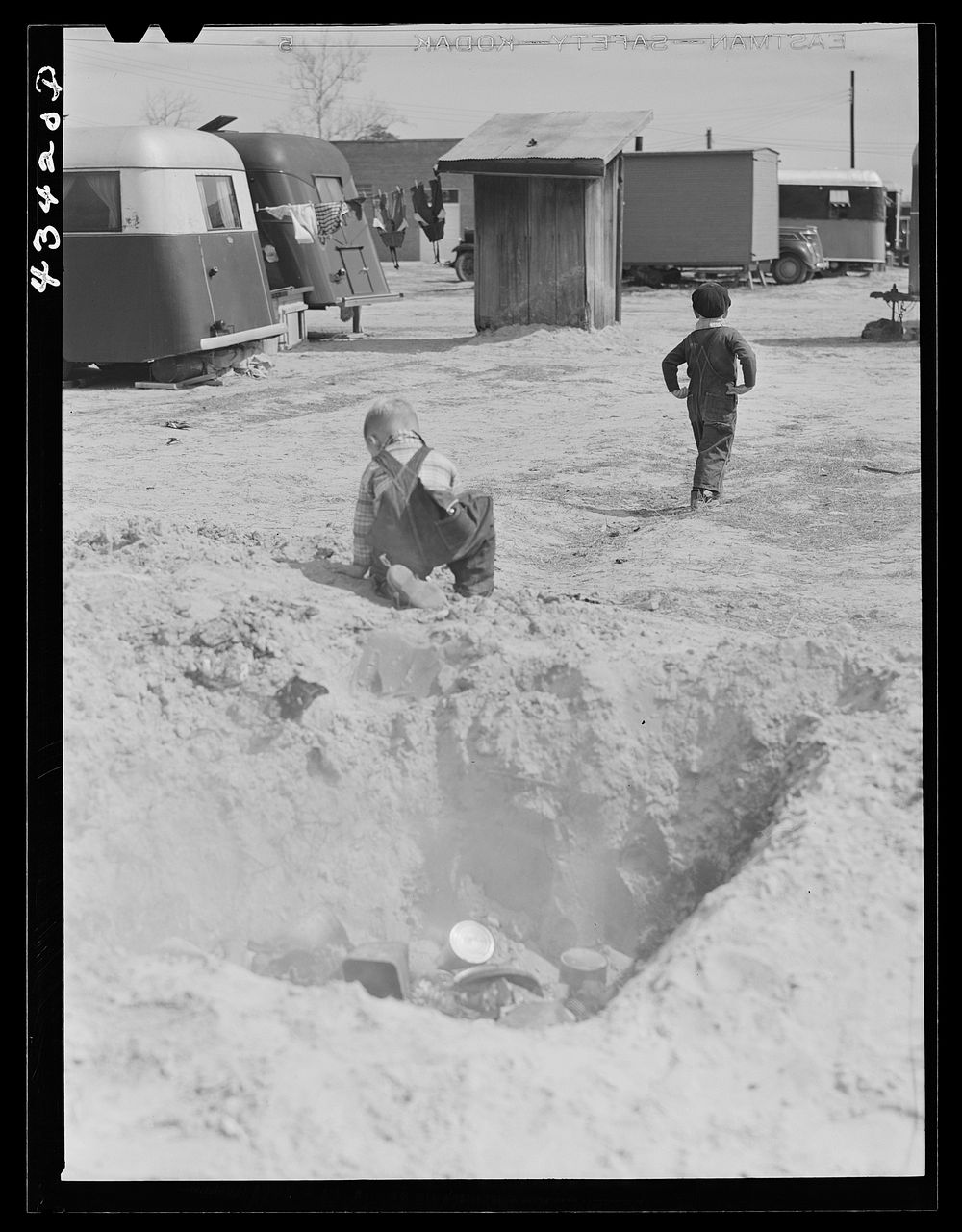 Children in trailer camp of construction workers from Fort Bragg. Near Fayetteville, North Carolina. Sourced from the…
