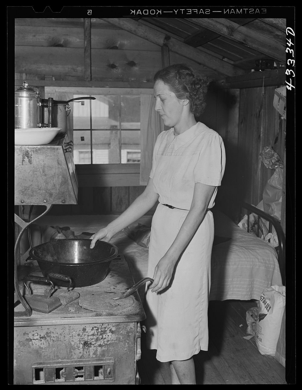 [Untitled photo, possibly related to: Children of workers from Fort Bragg living in a tobacco barn converted into living…