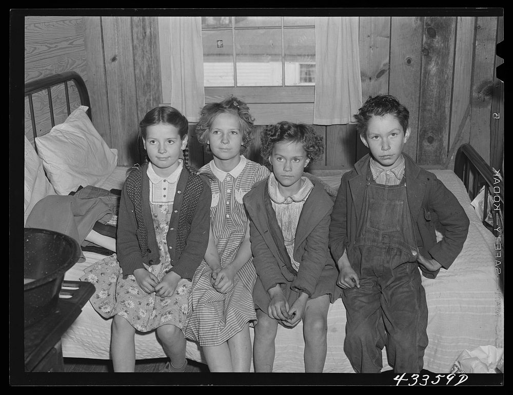 Children of families living in a tobacco barn near Fayetteville, North Carolina. Fathers work at Fort Bragg. Sourced from…