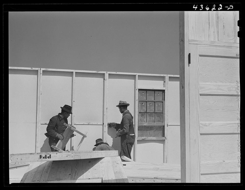 [Untitled photo, possibly related to: Working on a prefabricated house near Pacolet, South Carolina]. Sourced from the…