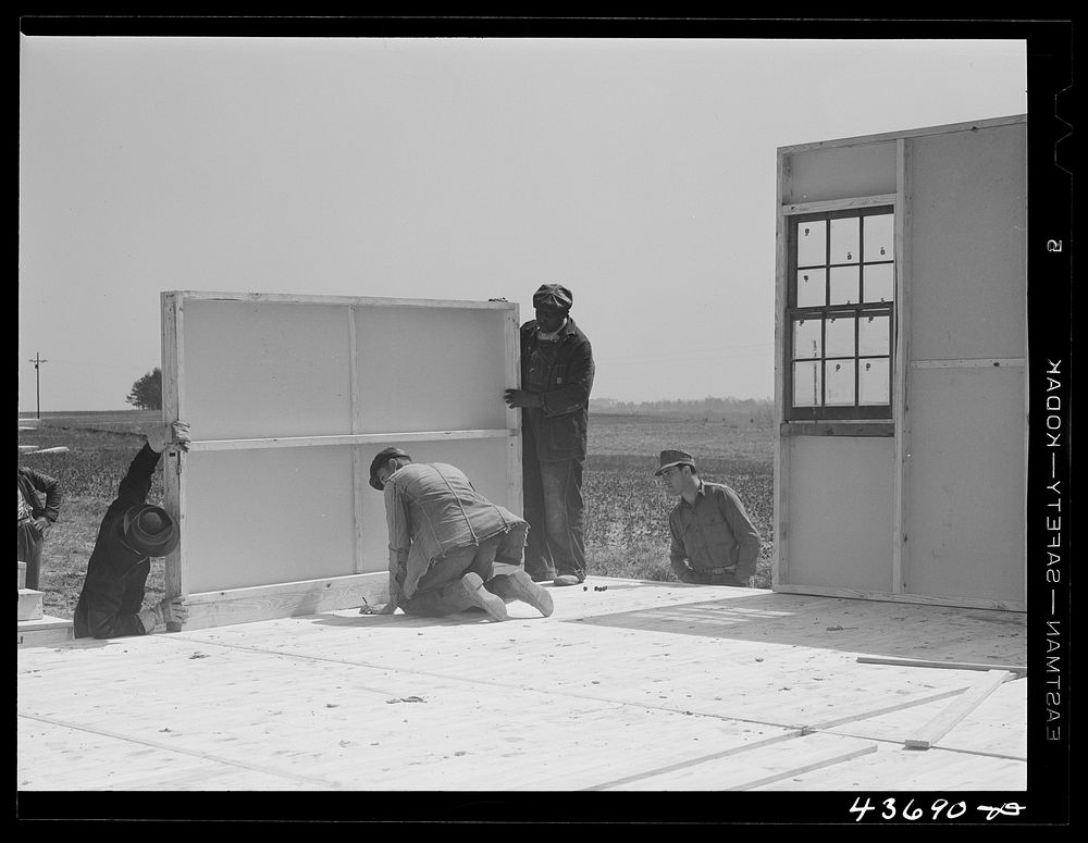 Putting up a wall in one of the prefabricated houses being built at Pacolet, South Carolina for farmers moved out of Camp…