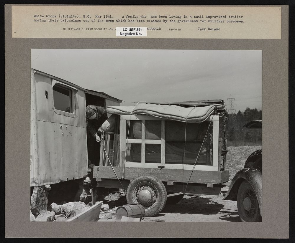 Family living in small improvised trailer moving their belongings out of the Camp Croft area. Near Pacolet, South Carolina…