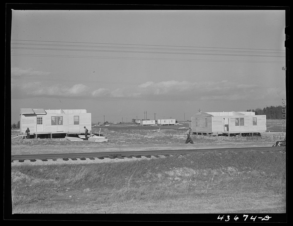 Prefabricated houses being built near Pacolet, South Carolina by FSA (Farm Security Administration) for farmers moved out of…