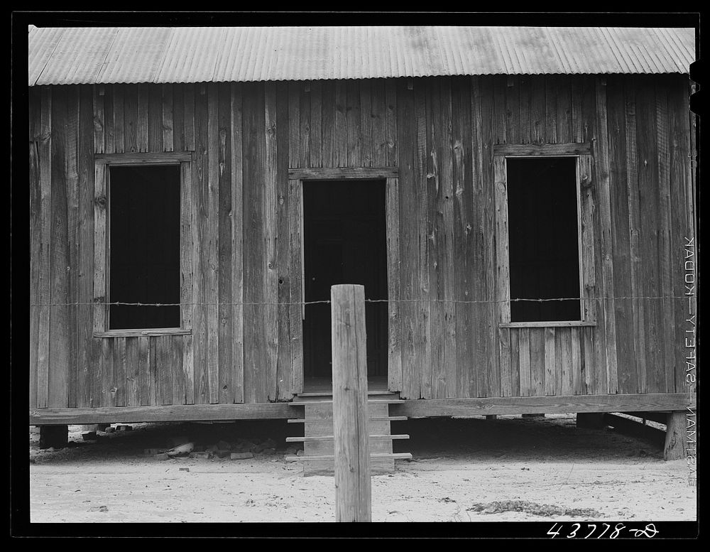 House in a deserted turpentine camp in the Camp Stewart area near Hinesville, Georgia. Sourced from the Library of Congress.