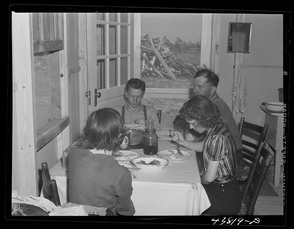 The family of Mr. B. B. West having lunch in their new prefabricated house at Pacolet, South Carolina. Sourced from the…