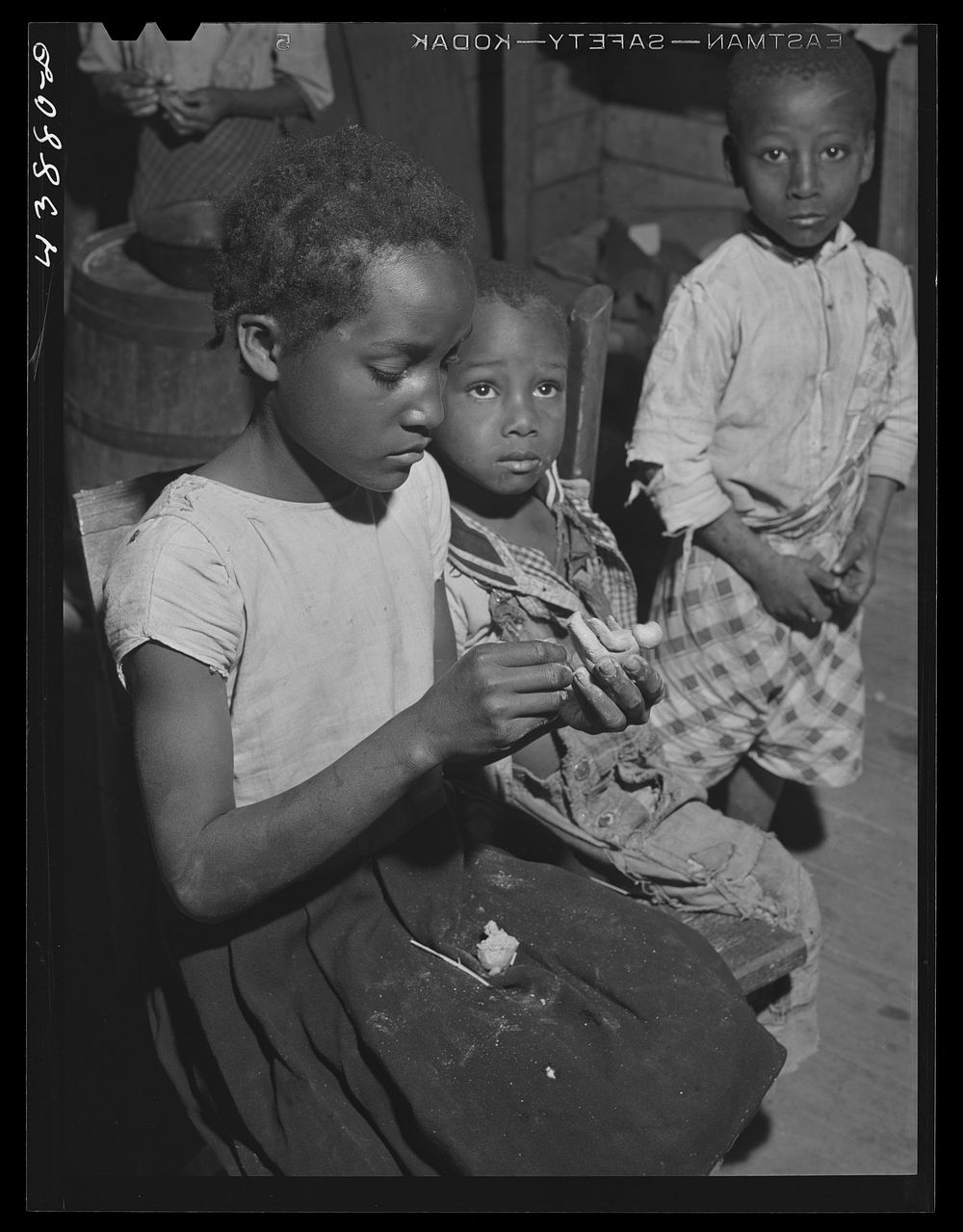 The children of Mr. Frank Cunningham,  FSA (Farm Security Administration) borrower, model figures, airplanes etc., with the…