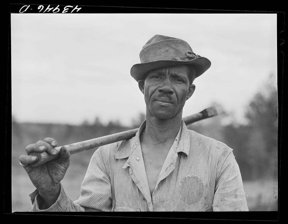 [Untitled photo, possibly related to: Henry Dukes,  FSA (Farm Security Administration) borrower, burning charcoal.…