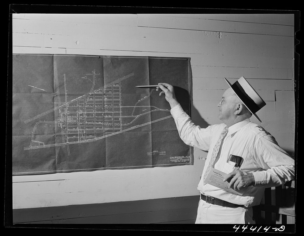 Mr. H.D. Wilson, mayor of Childersburg, Alabama pointing, out the location of one of the expected federal housing…