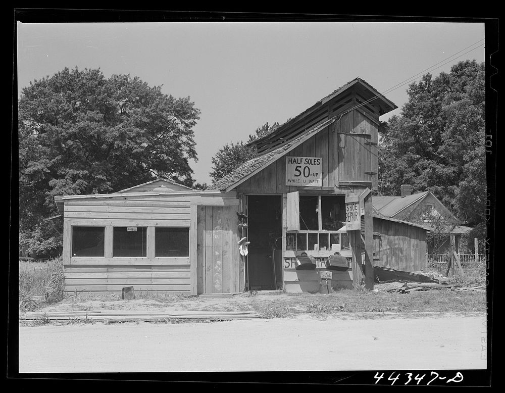 A shoe repair shop, recently constructed, in Childersburg, Alabama. Sourced from the Library of Congress.