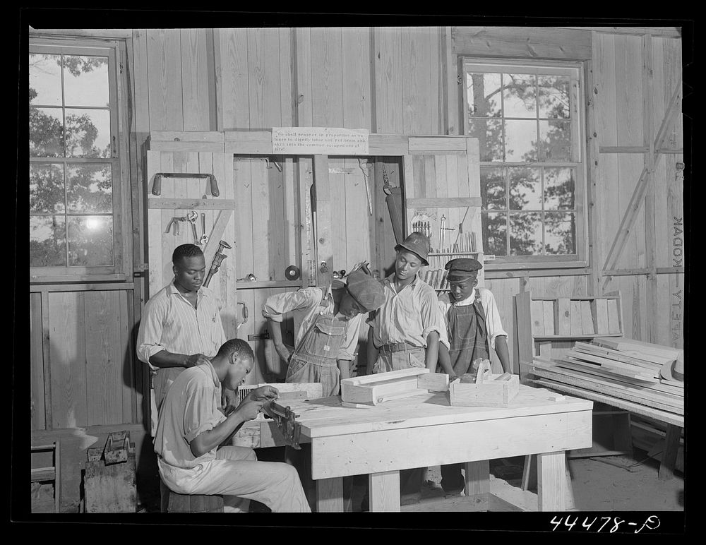  youngsters learning how to sharpen saws in a new vocational school. Greene County, Georgia. Sourced from the Library of…