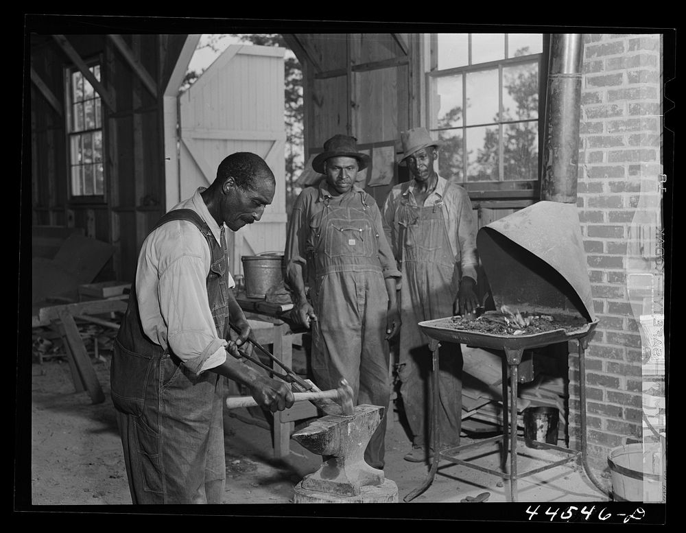 [Untitled photo, possibly related to:  farmer sharpening plow points at a new vocational school in Greene County, Georgia].…