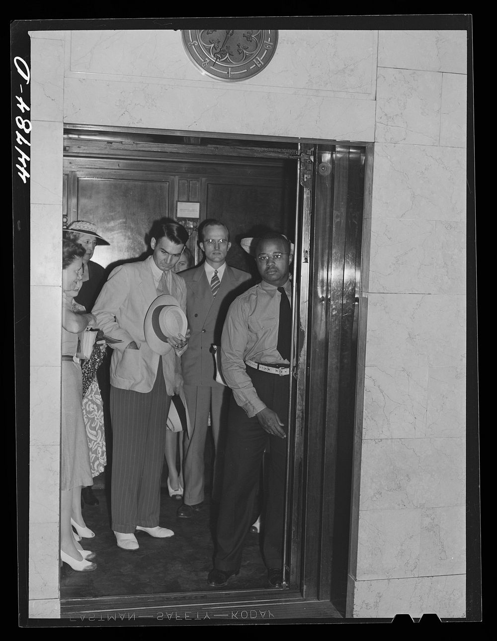 [Untitled photo, possibly related to: Elevator operator in the Barr Building. Washington, D.C.]. Sourced from the Library of…