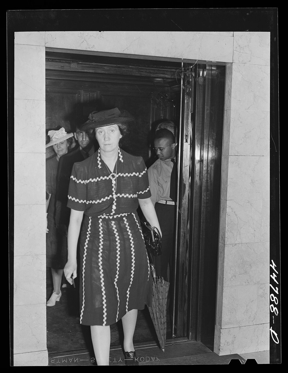 [Untitled photo, possibly related to: Elevator operator in the Barr Building. Washington, D.C.]. Sourced from the Library of…