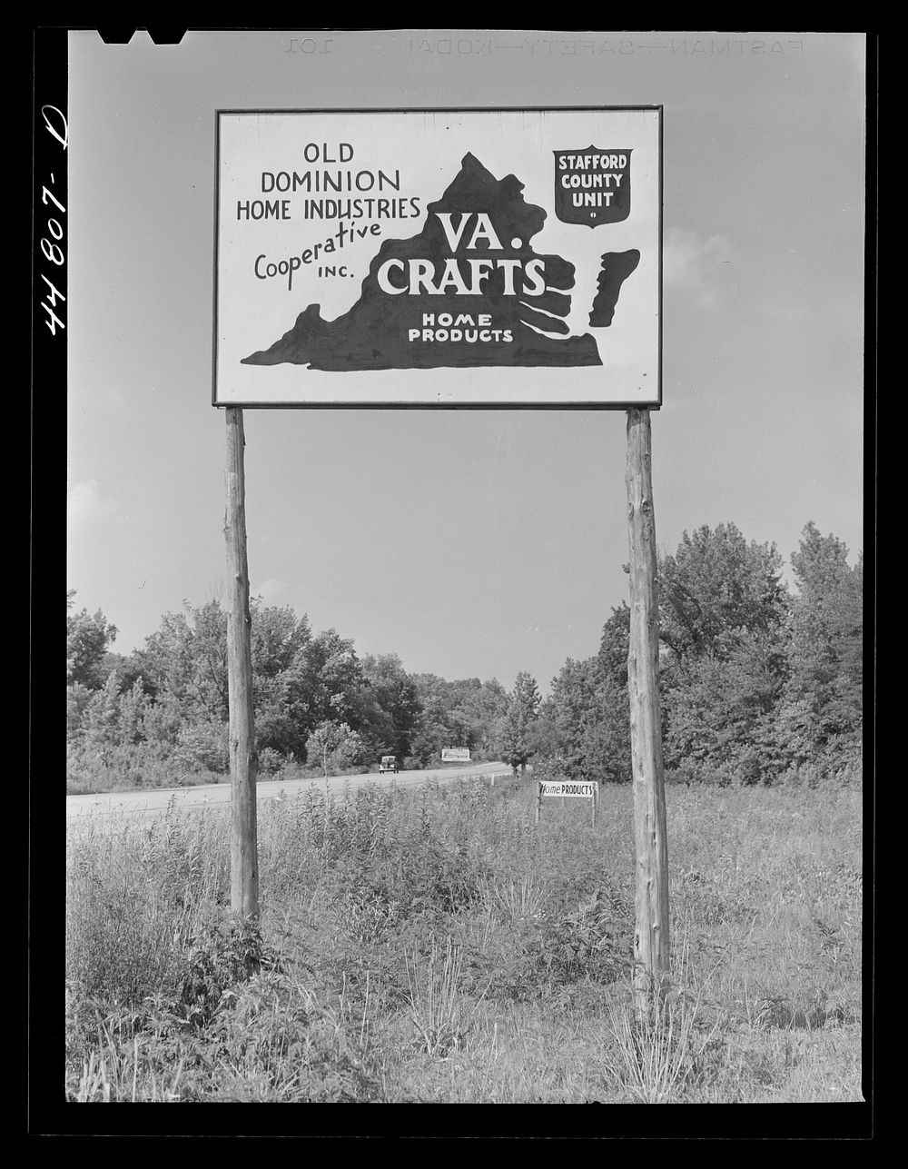 Virginia crafts co-op sign on U.S. Highway No. 1, about twenty miles north of Fredericksburg, Virginia. Sourced from the…