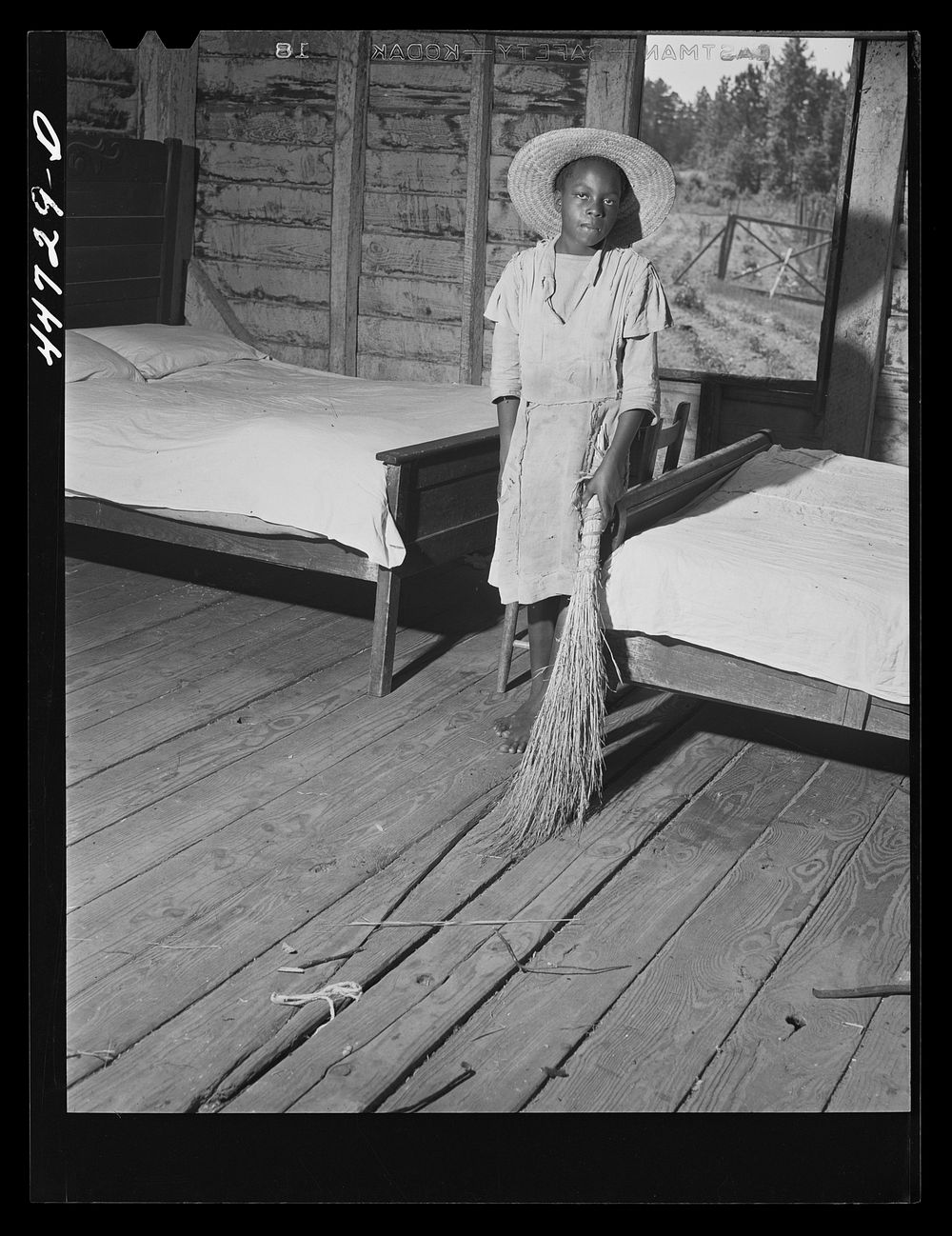 Daughter of Mr. Frank Champian, FSA (Farm Security Administration) borrower, sweeping up. Near White Plains, Greene County…
