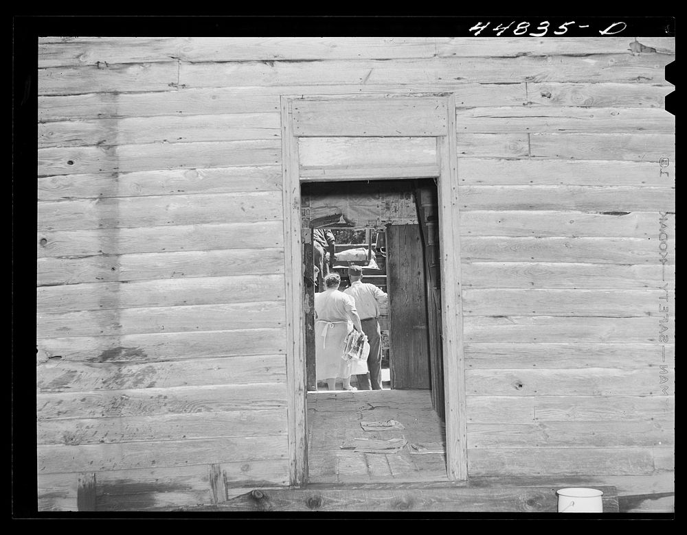 [Untitled photo, possibly related to: Mrs. Russell Tombs and her family moving out of the area being taken over by the Army…