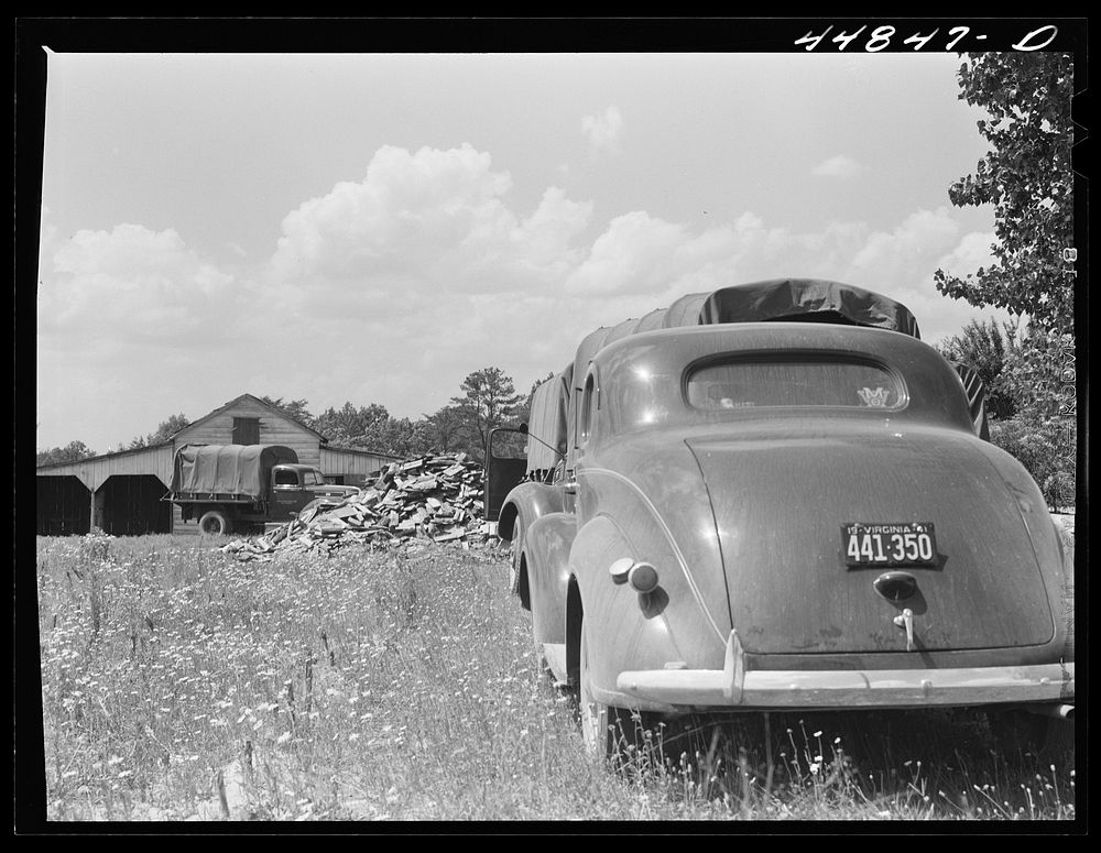 CCC (Civilian Conservation Corps) boys and trucks were used to help some of the families move out of the area being taken…