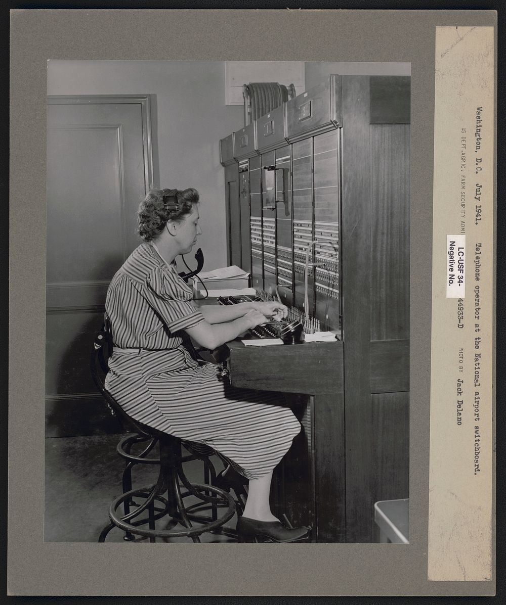 Telephone operator at the airport switchboard. Municipal airport, Washington, D.C.. Sourced from the Library of Congress.