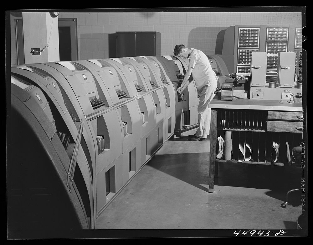 In the teletype room, where weather data and other information is constantly being received. Municipal airport, Washington…