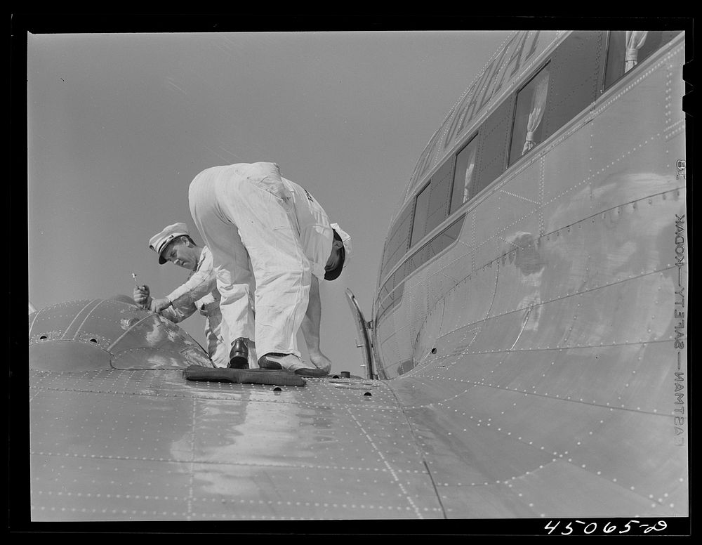 Checking the fuel of an airliner. Municipal airport, Washington, D.C.. Sourced from the Library of Congress.