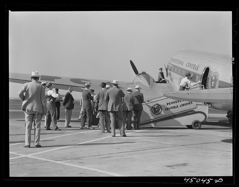 Passengers boarding an airliner. Municipal airport, Washington, D.C.. Sourced from the Library of Congress.