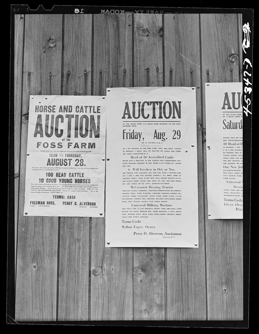 Auction notices of farms in the Pine Camp expansion area posted on a barn at the Ingalls farm near Antwerp, New York.…