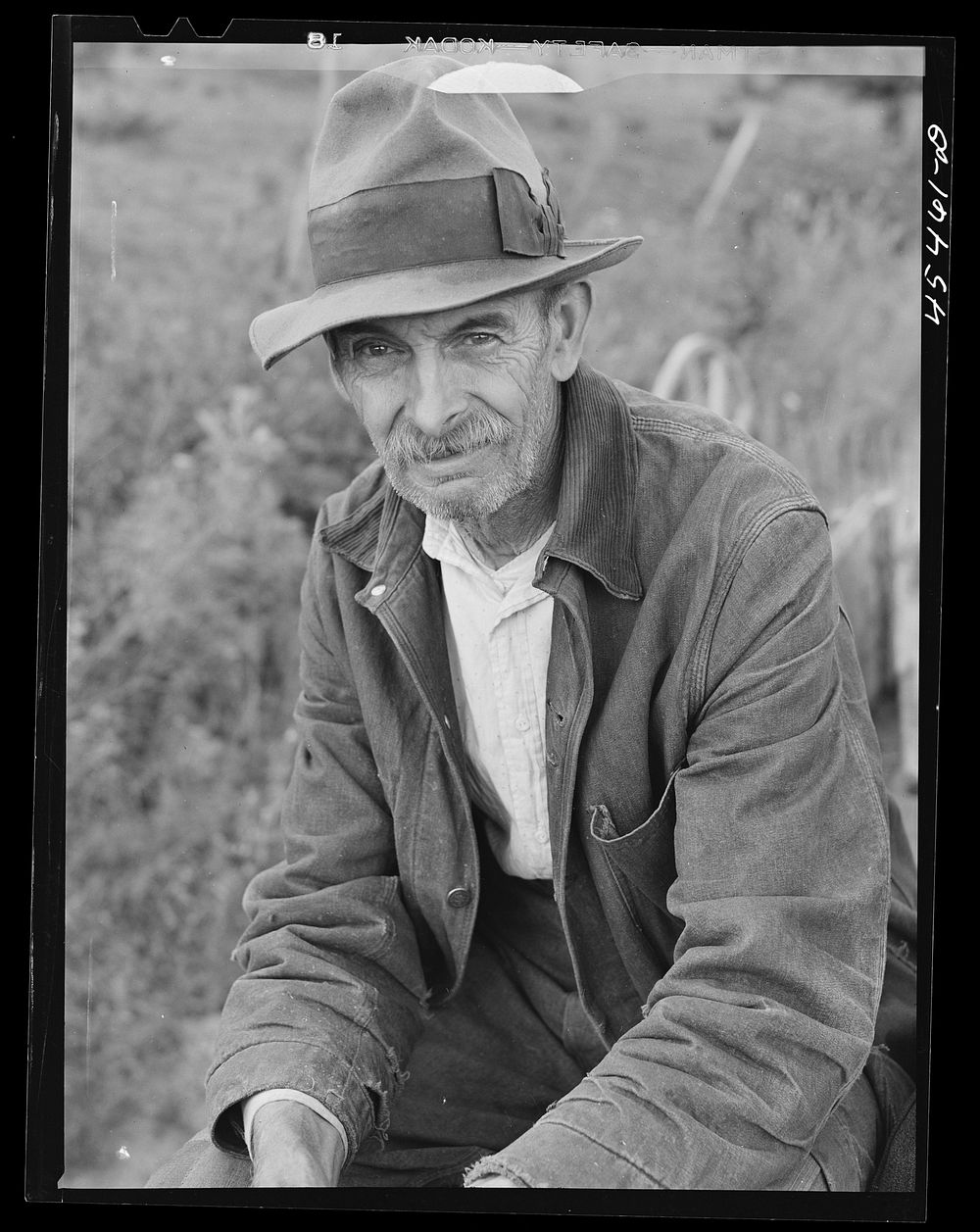 Mr. Eliot H. Miller, FSA (Farm Security Administration) dairy farmer at Castleton, Vermont. Sourced from the Library of…