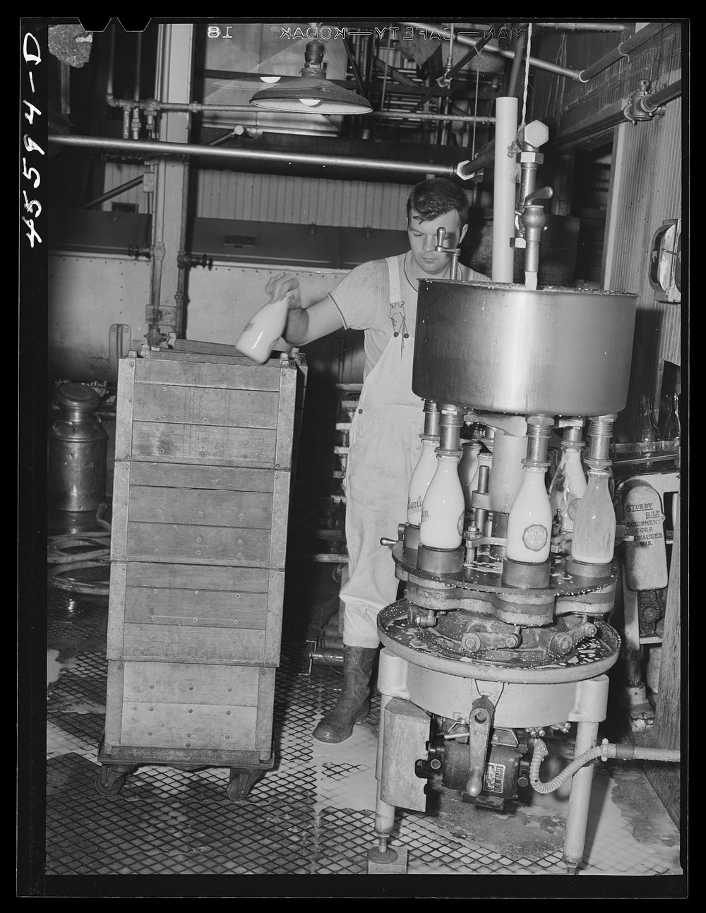 In the Burlington cooperative milk bottling plant. Burlington, Vermont. Sourced from the Library of Congress.