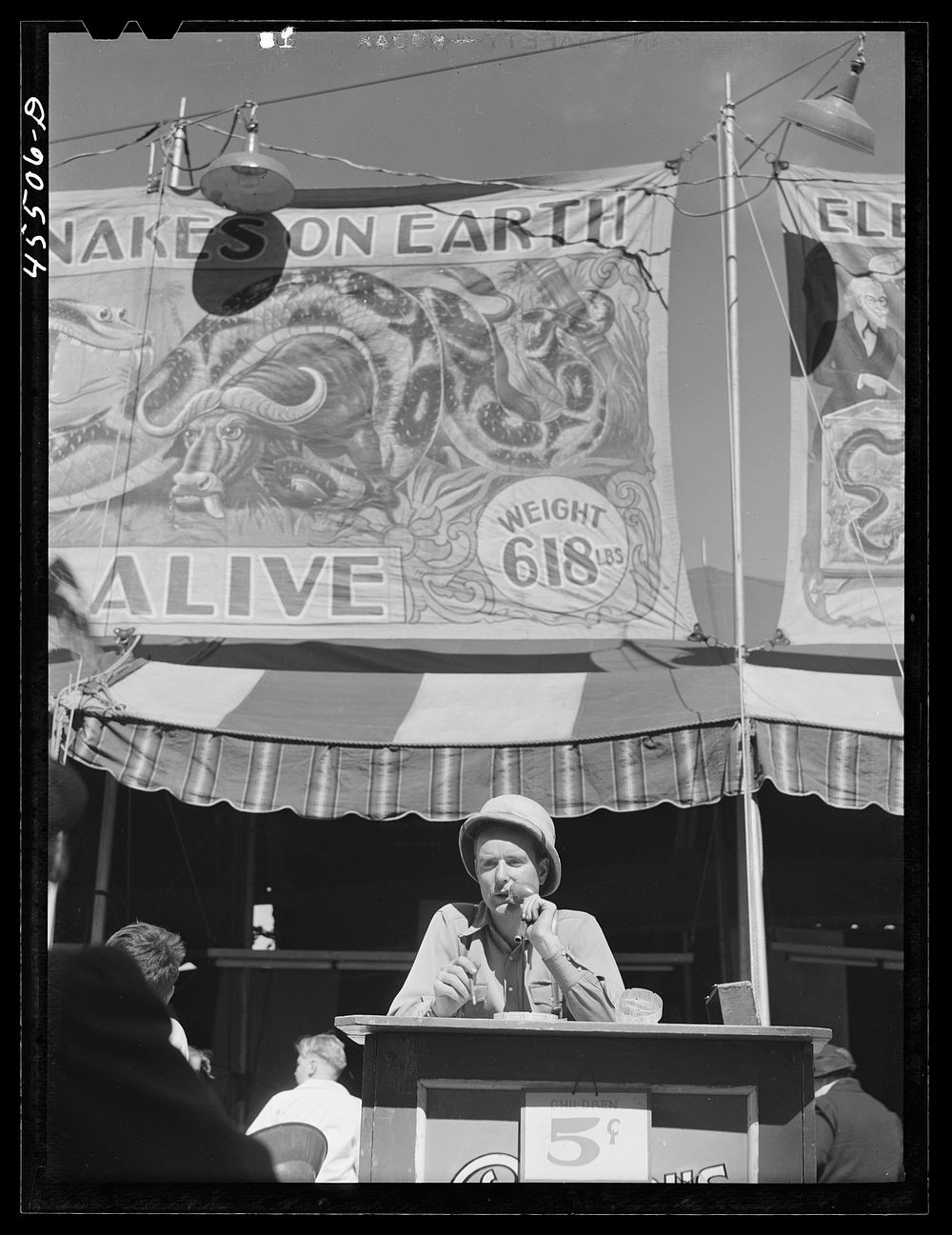 [Untitled photo, possibly related to: Buying tickets for the snake show at the Rutland Fair, Vermont]. Sourced from the…