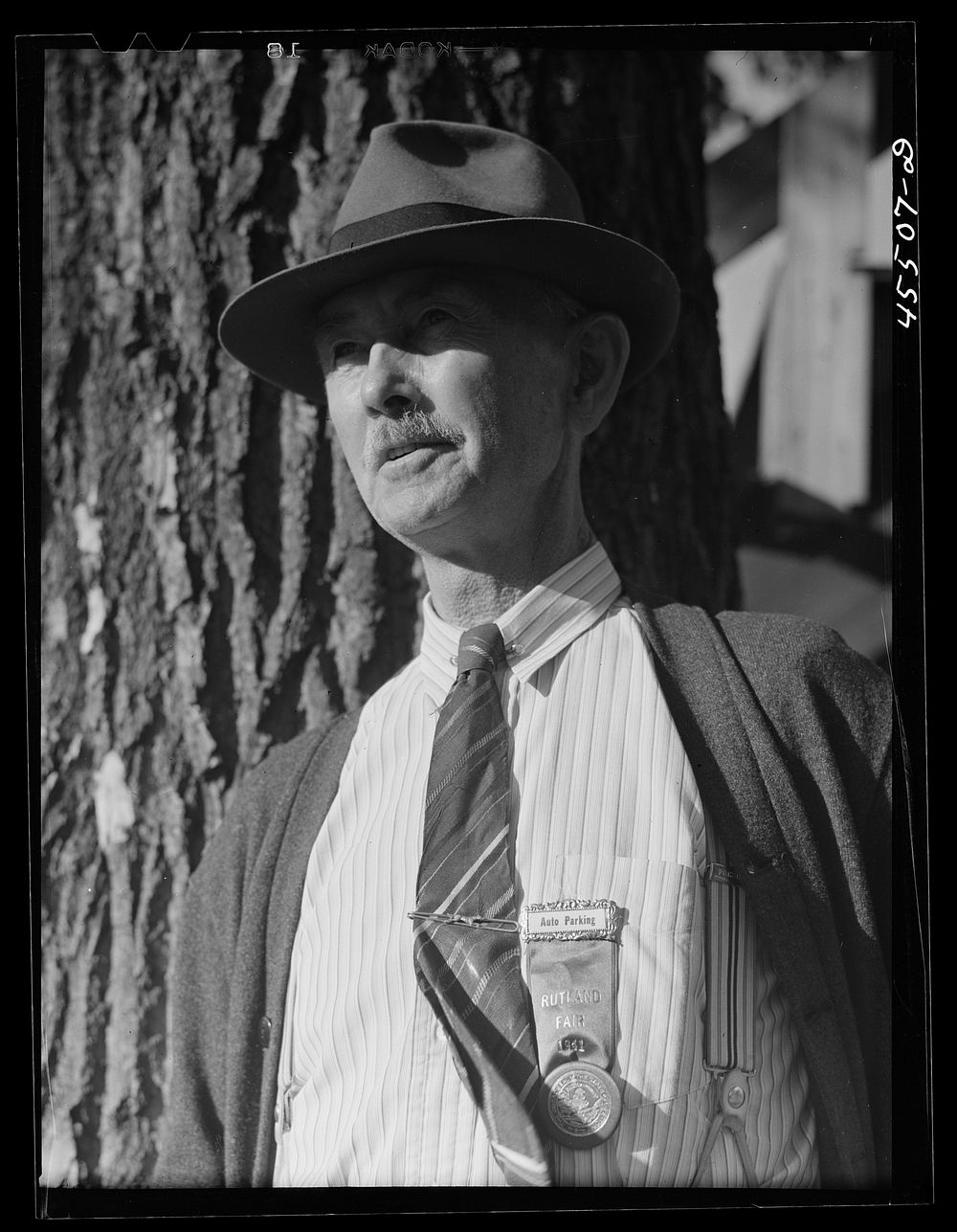 A committee member of the fair in charge of auto parking. Rutland Fair, Vermont. Sourced from the Library of Congress.
