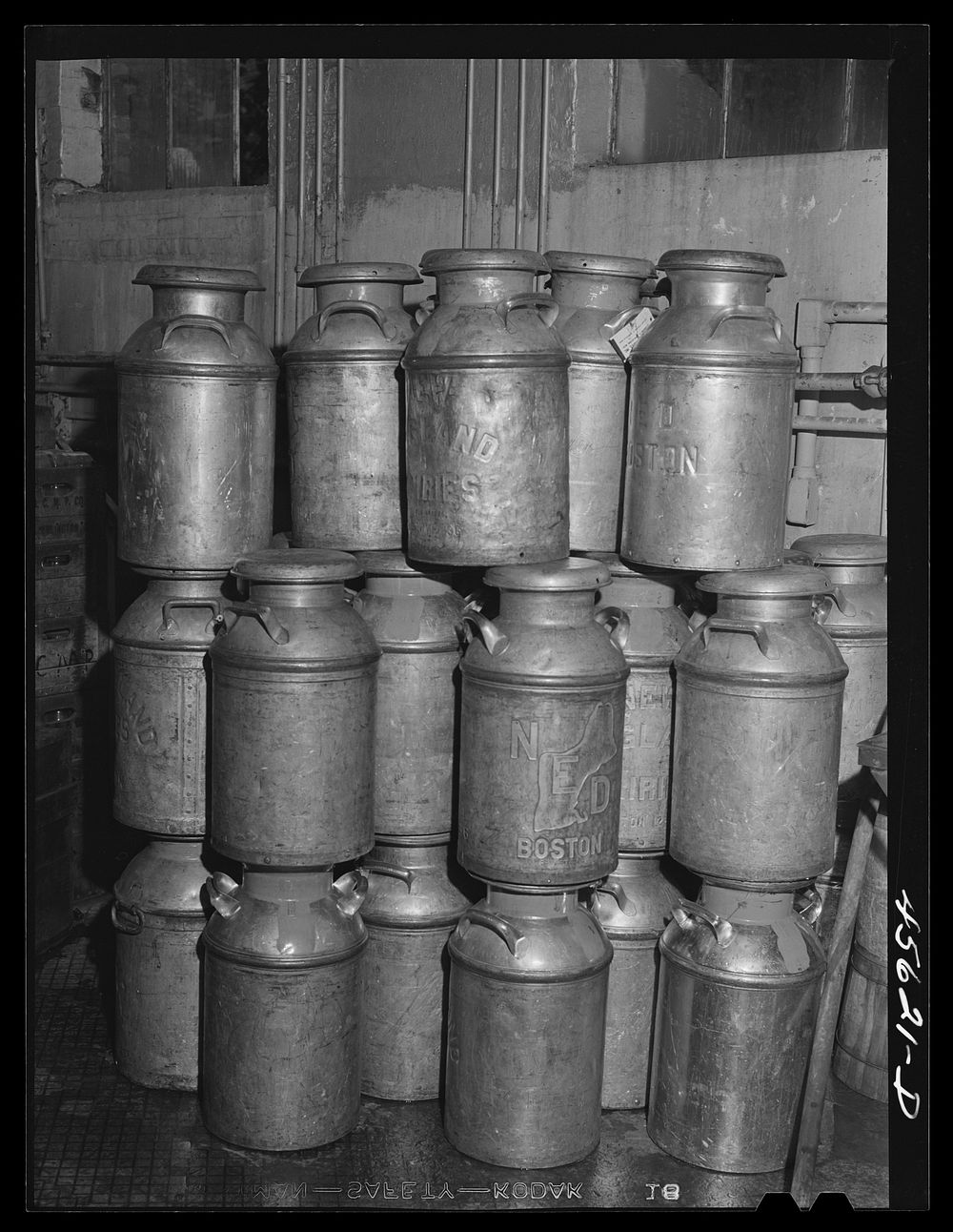 [Untitled photo, possibly related to: Farmer getting his empty milk cans back at the Burlington cooperative milk bottling…