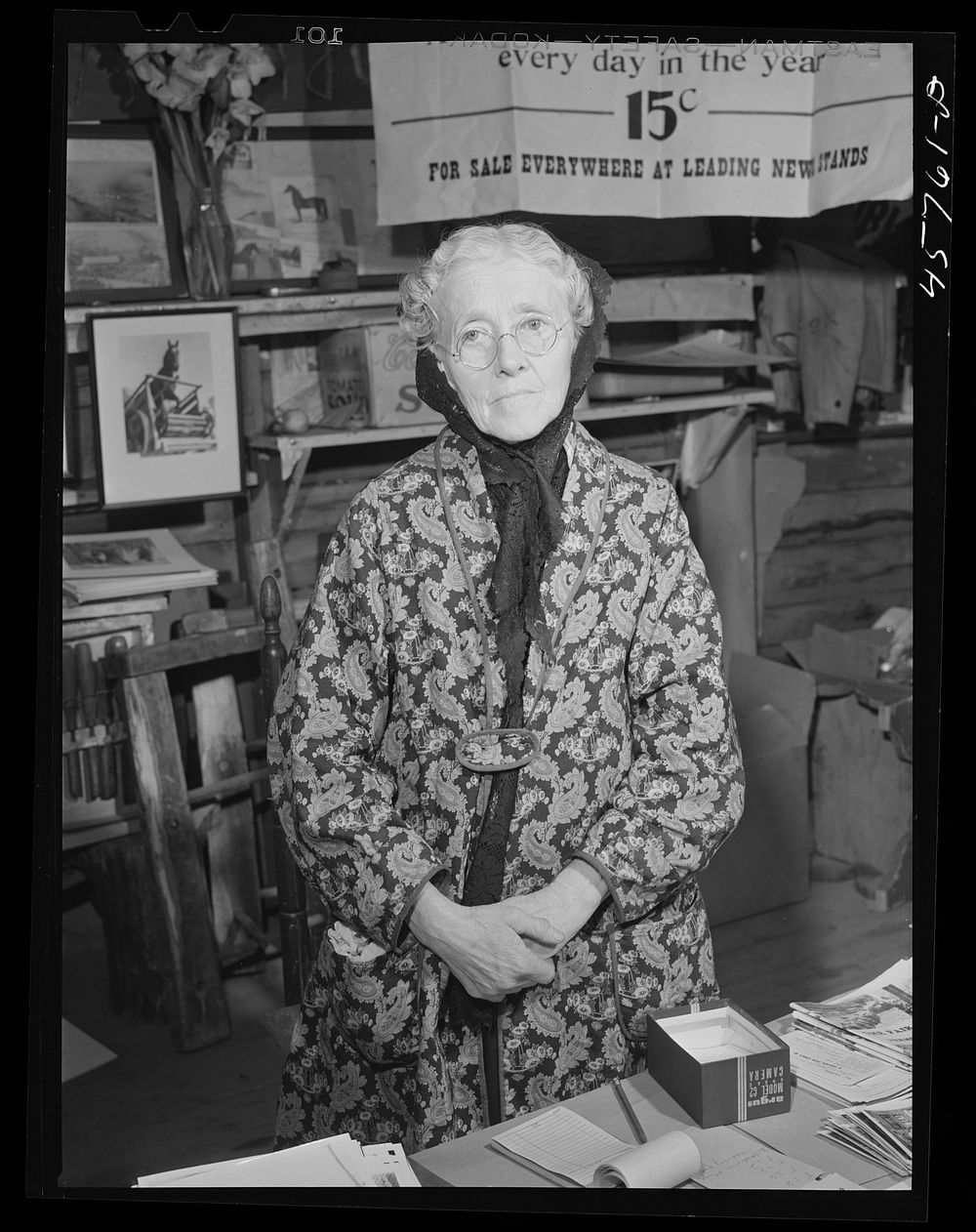 Mrs. Nellie Burroughs of Tunbridge selling pictures and souvenirs at the World's Fair, Vermont. Sourced from the Library of…