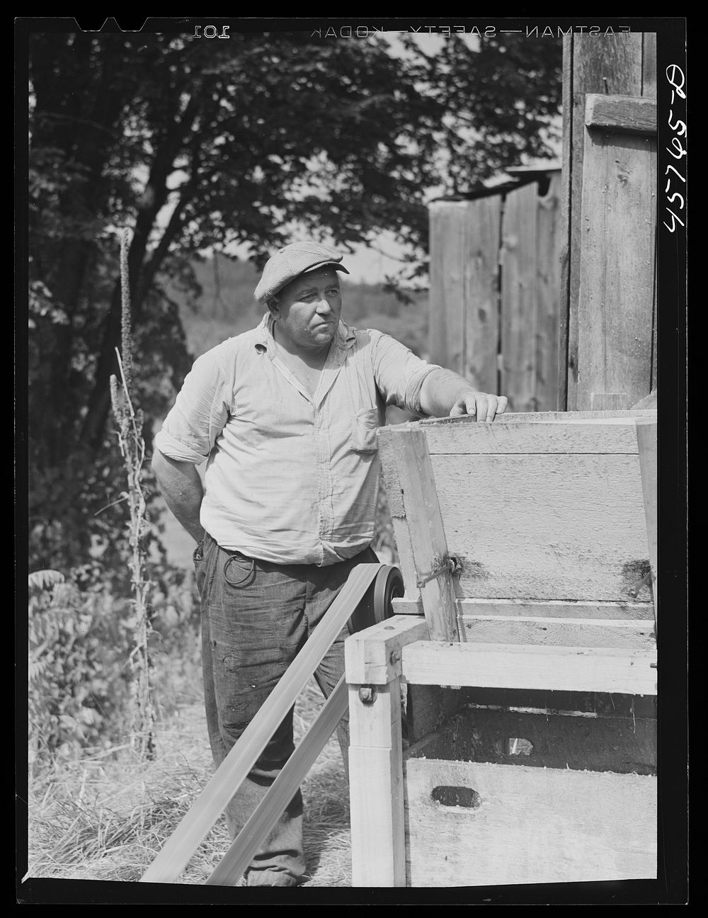 Tunbridge farmer at the cider making machine at the World's Fair. Tunbridge, Vermont. Sourced from the Library of Congress.