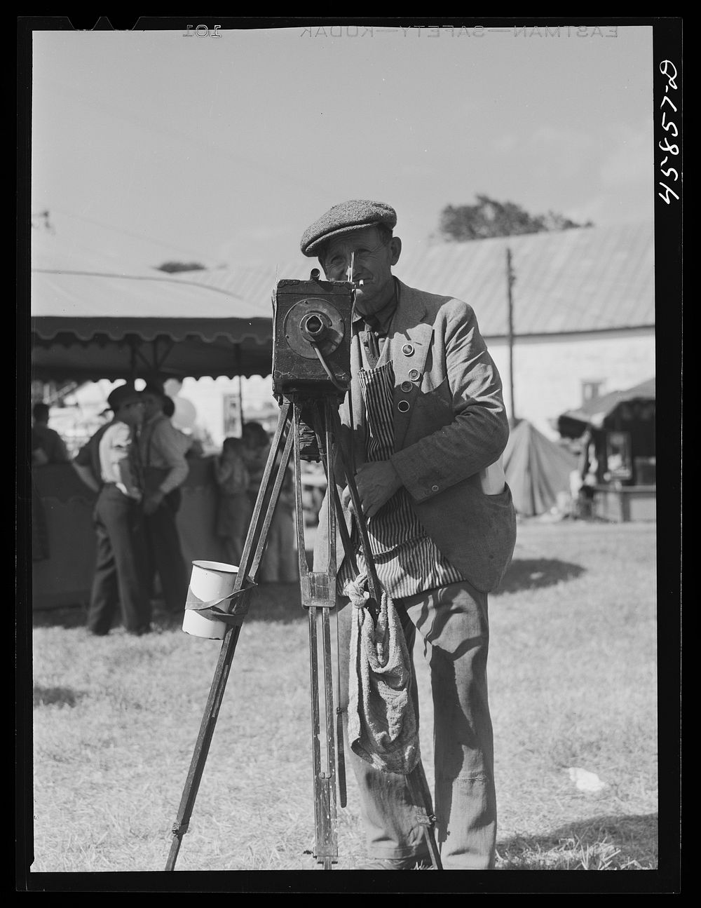 Tintype photographer at the World's Fair. Tunbridge, Vermont. Sourced from the Library of Congress.