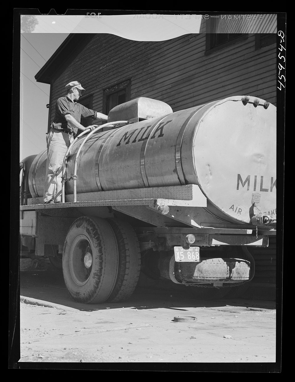 [Untitled photo, possibly related to: Milk truck in front of the New England Dairies in Enosburg Falls, Vermont]. Sourced…
