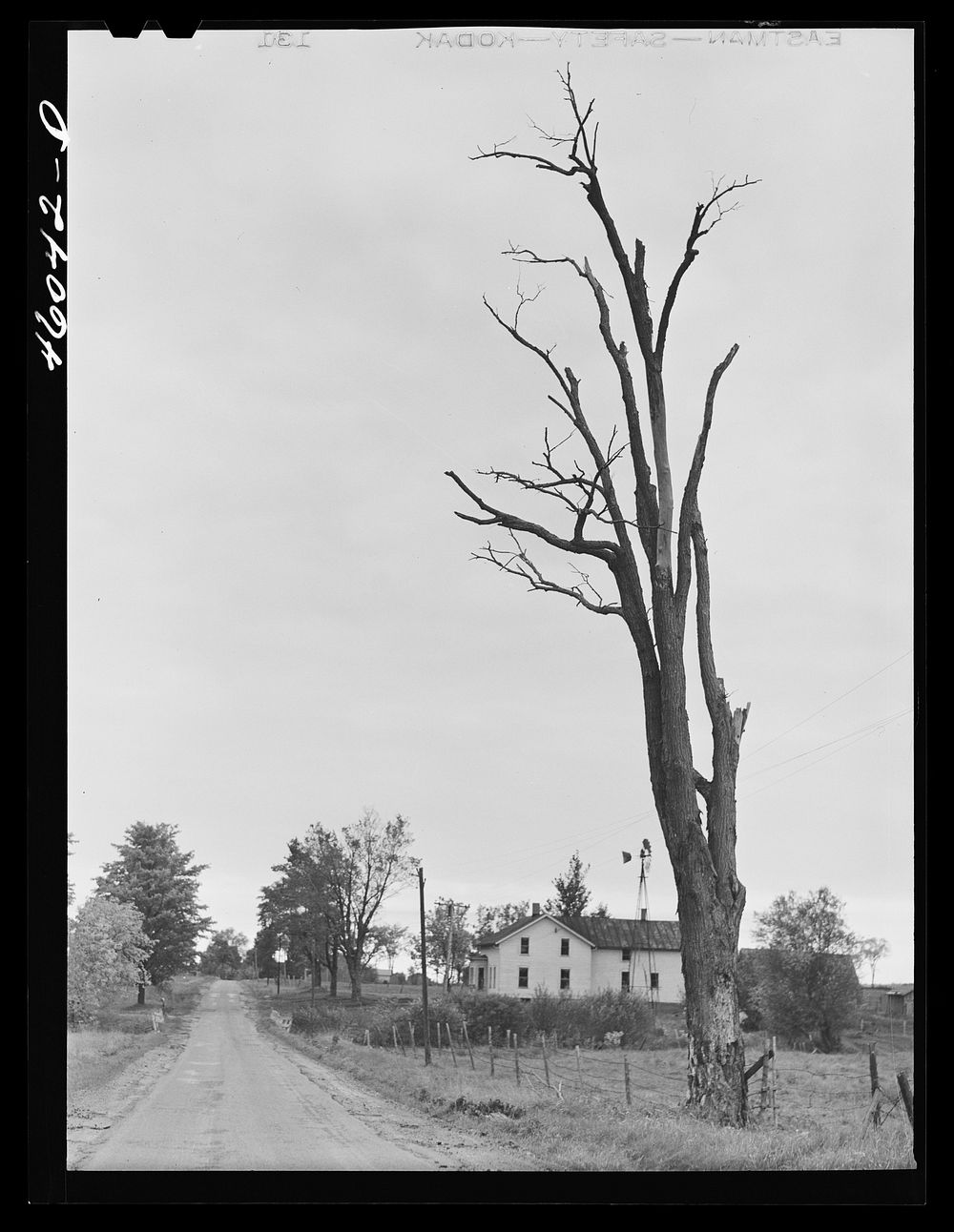 Road in the Pine Camp expansion area. Houses are now abandoned near Sterlingville, New York. Sourced from the Library of…