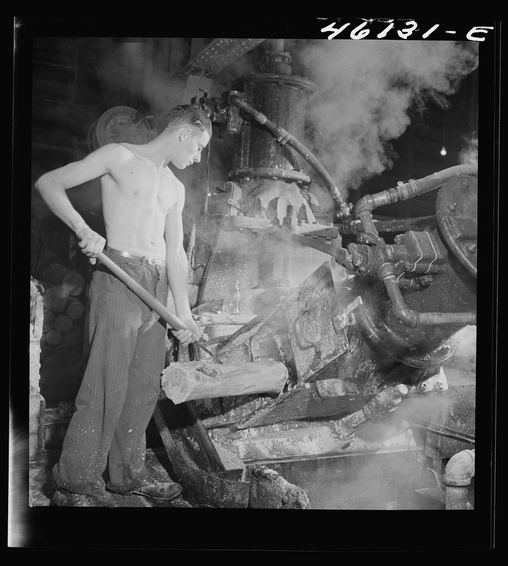 One of the machines that grinds wood into pulp at the Mississquoi Corporation paper mill, Sheldon, Springs, Vermont. Sourced…