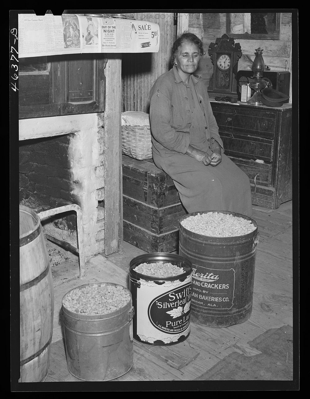The mother of Mr. Edgar Jones, FSA (Farm Security Administration) client with peanuts that are being stored for the winter.…