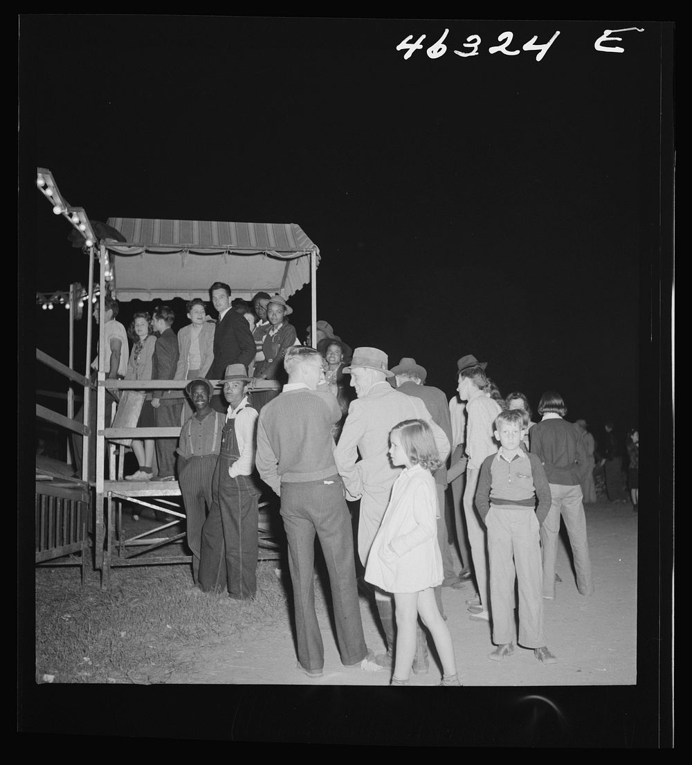 [Untitled photo, possibly related to: Greensboro, Georgia. The Greene County fair in the evening]. Sourced from the Library…