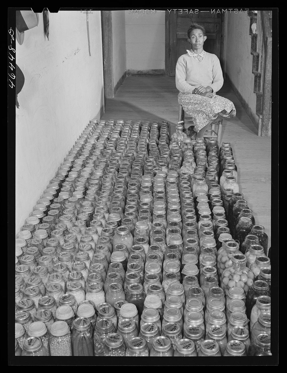 [Mrs. Edmond Reid], FSA (Farm Security Administration) client, with her canned goods. Oakland community, Greene County…