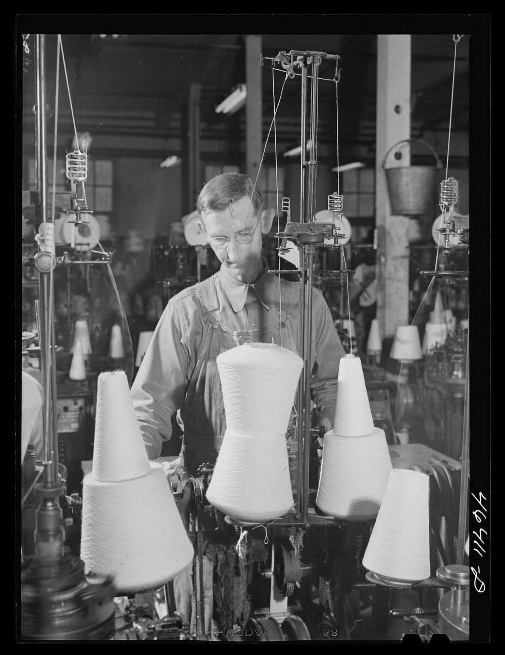 In the textile mill in Union Point, Greene County, Georgia. Sourced from the Library of Congress.