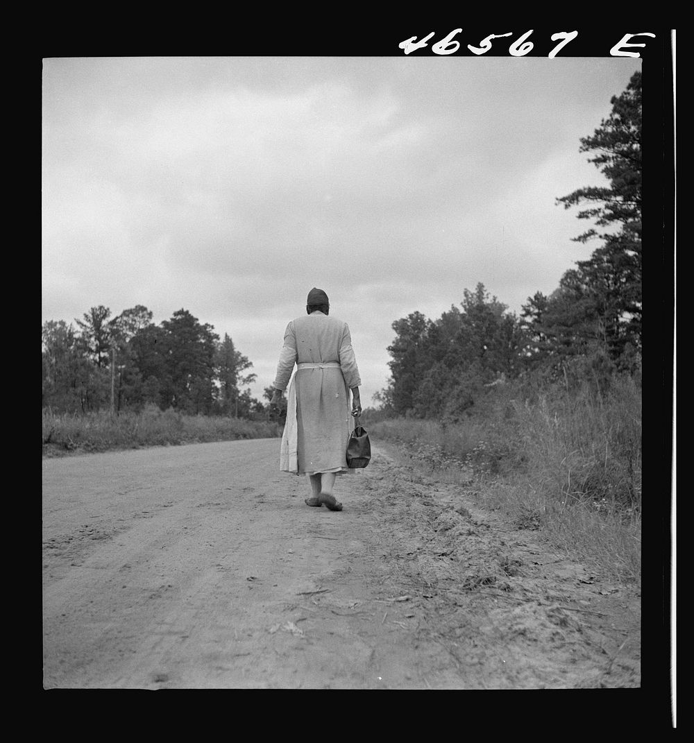 [Untitled photo, possibly related to: Midwife going on a call, carrying her kit, near Siloam, Greene County, Georgia].…